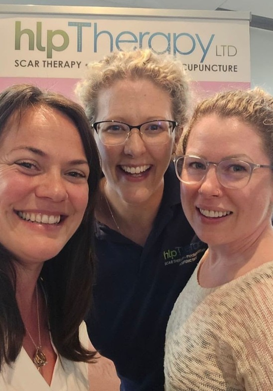 Cheryl smiles at the camera along with Hannah of HLP Therapy, and her colleague Michelle